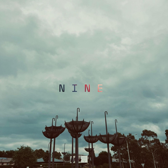 N I N E cover art